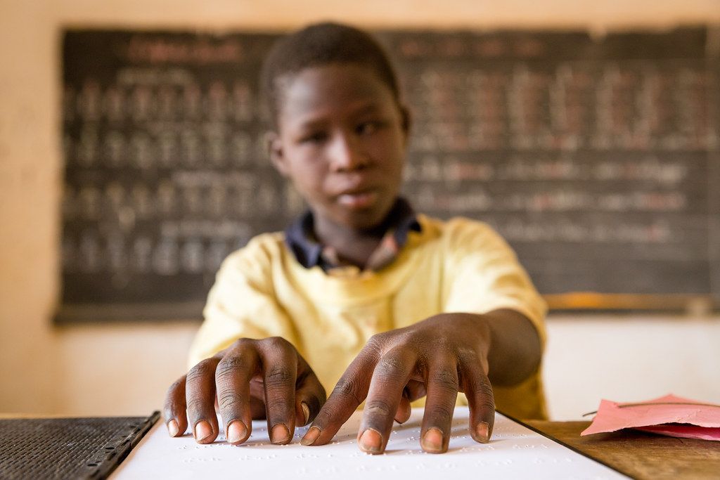 Abdul Aziz Mounkeila learns to read Braille at Ecole Yantala 2, one of 26 schools nationwide that offer integrated classrooms to the deaf and blind.