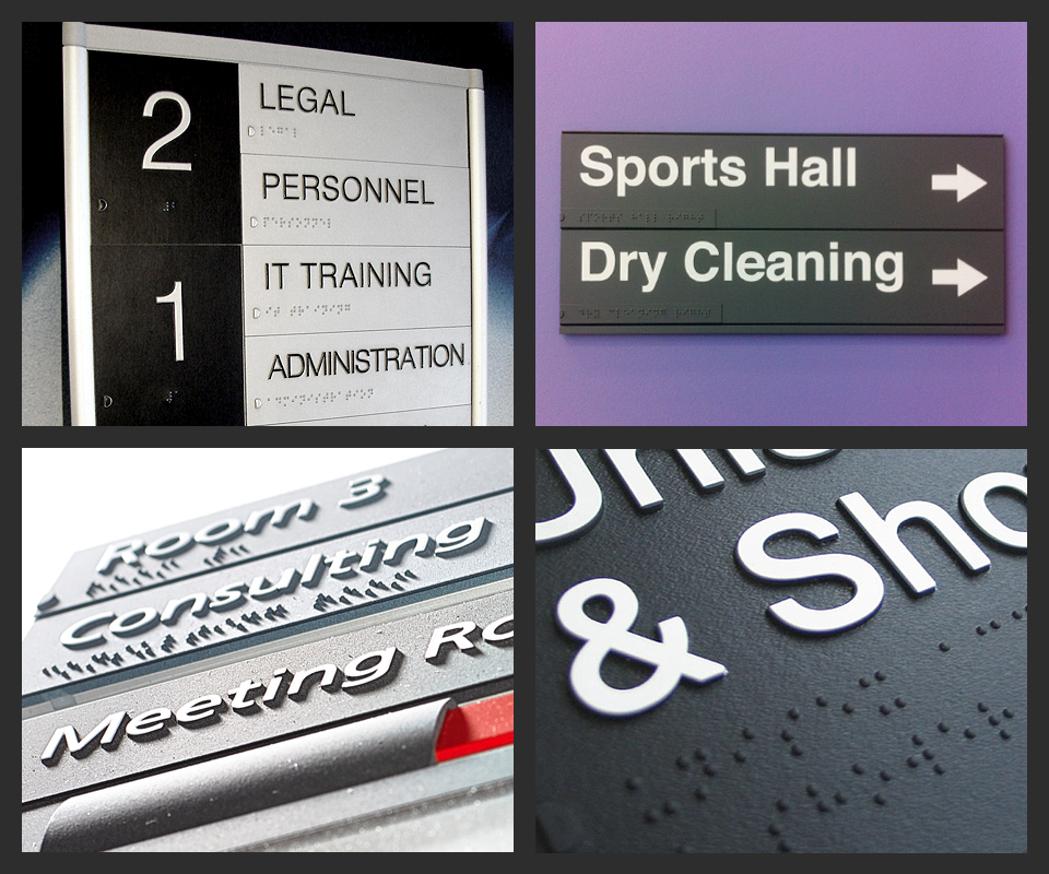 Various public signage, such as office rooms "Legal", "Personnel", "IT Training", "Domestic", "Room B", "Consulting", and others like "Sports Hall" and "Dry Cleaning" are visible in both standard English and Braille English
