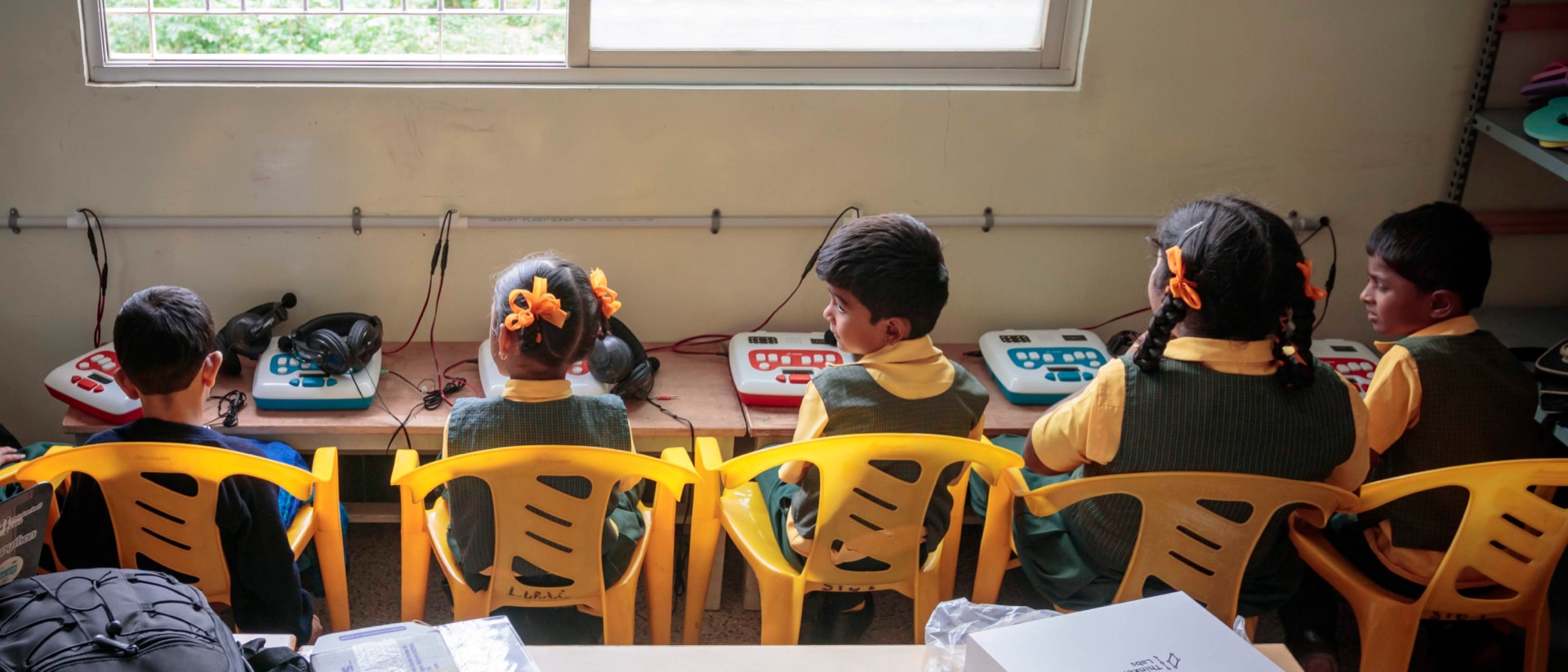 A Braille Smart Class: a row of students working on their own Annie units