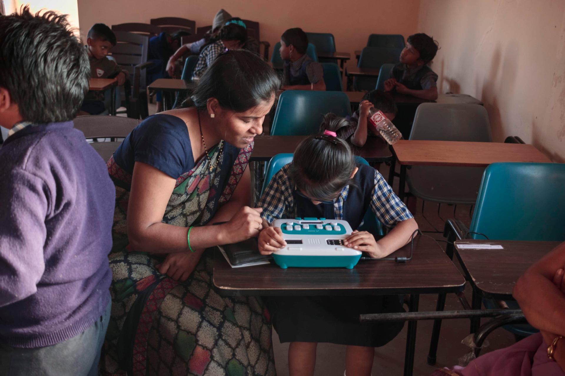 A teacher guiding a student through a lesson on Annie